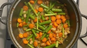 The Best 1-Pot Traditional Spaghetti Bolognese Recipe Traditional Spaghetti Bolognese Recipe :Vegetables sautéing in a pot with olive oil.